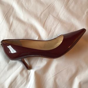 Red patent leather pumps